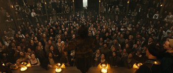 Movie still from “Anonymous” (2011), directed by Roland Emmerich – A group of people sitting in front of an audience; Wide shot, High angle