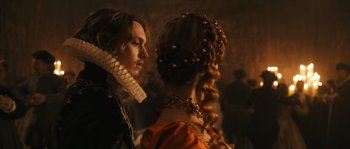 Movie still from “Anonymous” (2011), directed by Roland Emmerich – A man and a woman dressed in renaissance clothing; Close Up shot, Over the shoulder angle