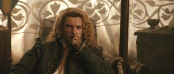 Movie still from “Anonymous” (2011), directed by Roland Emmerich – A person with curly hair; Close Up shot, Over the shoulder angle