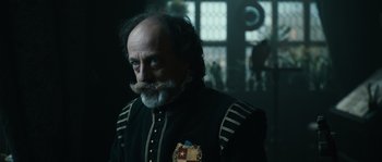 Movie still from “Anonymous” (2011), directed by Roland Emmerich – A man with a beard and mustache wearing a uniform; Close Up shot, Low angle