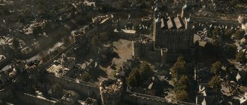 Movie still from “Anonymous” (2011), directed by Roland Emmerich – An aerial view of an old castle in the middle of a city; Extreme Wide shot, High angle