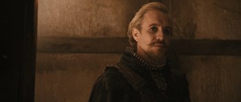 Movie still from “Anonymous” (2011), directed by Roland Emmerich – A person with a beard; Close Up shot, Over the shoulder angle