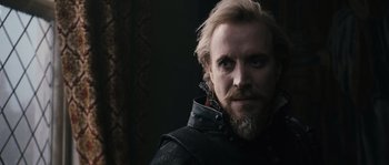 Movie still from “Anonymous” (2011), directed by Roland Emmerich – A person with a beard; Close Up shot, Over the shoulder angle