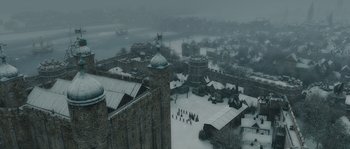 Movie still from “Anonymous” (2011), directed by Roland Emmerich – An aerial view of a castle in the middle of a snowy day; Extreme Wide shot, High angle