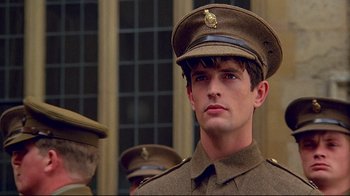 Movie still from “Another Country” (1984), directed by Marek Kanievska – A man in a military uniform is looking at the camera; Close Up shot, Low angle