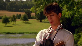 Movie still from “Another Country” (1984), directed by Marek Kanievska – A young man in a white shirt and a tie; Close Up shot, Over the shoulder angle