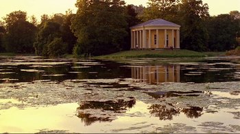 Movie still from “Another Country” (1984), directed by Marek Kanievska – A lake with a building in the middle of the water; Extreme Wide shot, Low angle