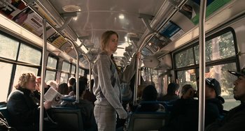 Movie still from “Another Earth” (2011), directed by Mike Cahill – A woman standing on a public transit bus; Medium shot, Low angle