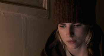 Movie still from “Another Earth” (2011), directed by Mike Cahill – A person wearing a hat; Close Up shot, High angle