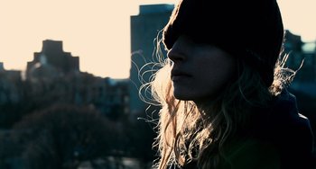 Movie still from “Another Earth” (2011), directed by Mike Cahill – A person with long hair; Close Up shot, Low angle