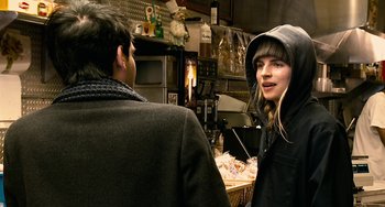 Movie still from “Another Earth” (2011), directed by Mike Cahill – A man and a woman are talking to each other in a kitchen; Close Up shot, Over the shoulder angle