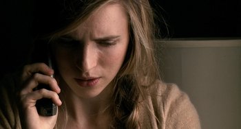 Movie still from “Another Earth” (2011), directed by Mike Cahill – A woman is talking on a cell phone; Close Up shot, Overhead angle