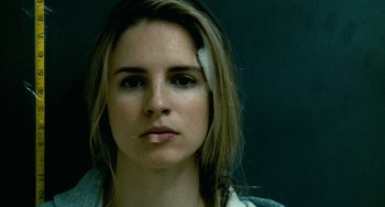 Movie still from “Another Earth” (2011), directed by Mike Cahill – A person with a bandage on their head; Close Up shot, Low angle