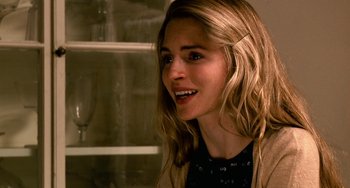 Movie still from “Another Earth” (2011), directed by Mike Cahill – A beautiful young lady with long blonde hair and blue eyes; Close Up shot, Over the shoulder angle