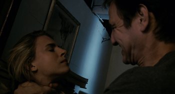 Movie still from “Another Earth” (2011), directed by Mike Cahill – A man and a woman face to face in a dark room; Close Up shot, Low angle
