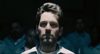 Movie still from “Ant-Man” (2015), directed by Peyton Reed – A person wearing a white shirt; Close Up shot, Over the shoulder angle