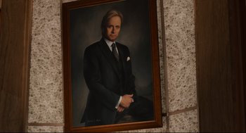 Movie still from “Ant-Man” (2015), directed by Peyton Reed – A picture of a man in a suit hanging on the wall; Close Up shot, Low angle