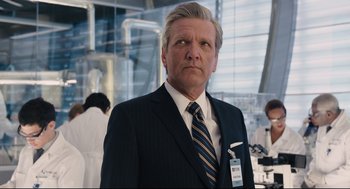 Movie still from “Ant-Man” (2015), directed by Peyton Reed – A man wearing a suit and tie in a lab; Close Up shot, Low angle