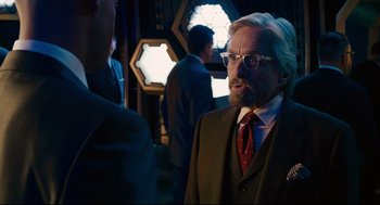Movie still from “Ant-Man” (2015), directed by Peyton Reed – An older man in a suit and tie talking; Close Up shot, Over the shoulder angle