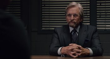 Movie still from “Ant-Man” (2015), directed by Peyton Reed – An older man sitting at a table in front of a computer; Close Up shot, Over the shoulder angle