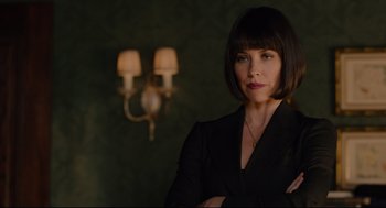 Movie still from “Ant-Man” (2015), directed by Peyton Reed – A woman in a black suit standing in front of a lamp; Close Up shot, Low angle