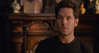 Movie still from “Ant-Man” (2015), directed by Peyton Reed – A person wearing a black t - shirt; Close Up shot, Over the shoulder angle