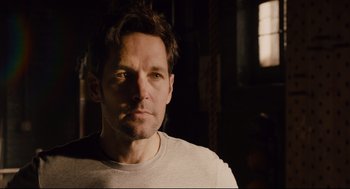 Movie still from “Ant-Man” (2015), directed by Peyton Reed – A person wearing a white t - shirt; Close Up shot, Over the shoulder angle