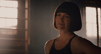 Movie still from “Ant-Man” (2015), directed by Peyton Reed – A woman in a black tank top is in a dark room; Close Up shot, Over the shoulder angle