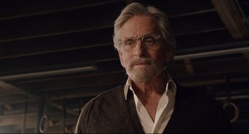Movie still from “Ant-Man” (2015), directed by Peyton Reed – An older man with glasses and a beard; Close Up shot, Low angle