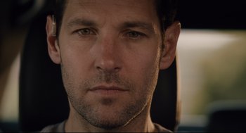 Movie still from “Ant-Man” (2015), directed by Peyton Reed – A man's face in a dark room; Close Up shot, Low angle