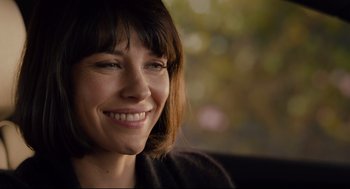 Movie still from “Ant-Man” (2015), directed by Peyton Reed – A person smiling with trees in the background; Close Up shot, Over the shoulder angle