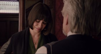 Movie still from “Ant-Man” (2015), directed by Peyton Reed – A woman in a green top is talking to an older man in a suit; Close Up shot, Over the shoulder angle