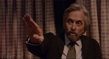 Movie still from “Ant-Man” (2015), directed by Peyton Reed – An older man in a suit and a tie; Close Up shot, Over the shoulder angle