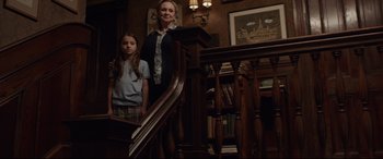 Movie still from “Ant-Man and the Wasp” (2018), directed by Peyton Reed – A woman and a little girl standing at the top of a staircase; Wide shot, High angle