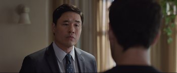 Movie still from “Ant-Man and the Wasp” (2018), directed by Peyton Reed – A man wearing a suit and tie looking at a man in a suit; Close Up shot, Over the shoulder angle