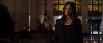 Movie still from “Ant-Man and the Wasp” (2018), directed by Peyton Reed – A woman standing in a room next to a window; Medium shot, Over the shoulder angle