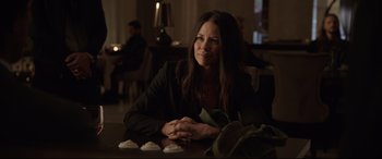 Movie still from “Ant-Man and the Wasp” (2018), directed by Peyton Reed – A woman sitting at a table in front of some cupcakes; Close Up shot, Over the shoulder angle