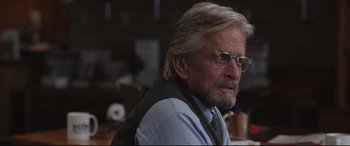Movie still from “Ant-Man and the Wasp” (2018), directed by Peyton Reed – An older man wearing glasses and wearing a vest; Close Up shot, Over the shoulder angle