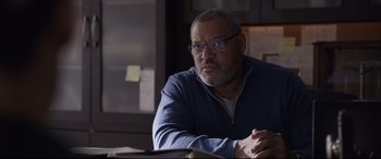 Movie still from “Ant-Man and the Wasp” (2018), directed by Peyton Reed – An older man sitting at a table in front of papers; Close Up shot, Over the shoulder angle