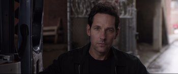 Movie still from “Ant-Man and the Wasp” (2018), directed by Peyton Reed – A man that is staring at the camera; Close Up shot, Over the shoulder angle