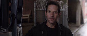 Movie still from “Ant-Man and the Wasp” (2018), directed by Peyton Reed – A man that is looking at the camera; Close Up shot, Over the shoulder angle