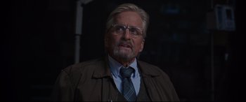 Movie still from “Ant-Man and the Wasp” (2018), directed by Peyton Reed – An older man wearing glasses and wearing a jacket; Close Up shot, Over the shoulder angle