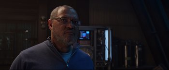 Movie still from “Ant-Man and the Wasp” (2018), directed by Peyton Reed – An older man wearing glasses in a recording studio; Close Up shot, Low angle