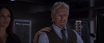 Movie still from “Ant-Man and the Wasp” (2018), directed by Peyton Reed – An older man wearing glasses and a sweater vest; Close Up shot, Over the shoulder angle