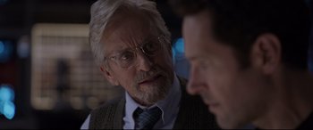 Movie still from “Ant-Man and the Wasp” (2018), directed by Peyton Reed – An older man wearing glasses talking to a younger man; Close Up shot, Over the shoulder angle