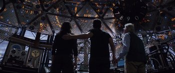 Movie still from “Ant-Man and the Wasp” (2018), directed by Peyton Reed – Two people standing next to each other in front of a building; Medium shot, Low angle