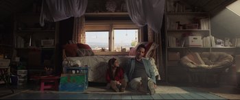 Movie still from “Ant-Man and the Wasp” (2018), directed by Peyton Reed – A man and a little girl sitting on the floor of a living room; Medium shot, Low angle