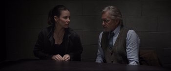 Movie still from “Ant-Man and the Wasp” (2018), directed by Peyton Reed – A man and a woman sitting at a table talking to each other; Medium shot, Over the shoulder angle