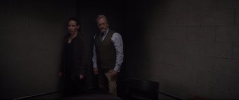 Movie still from “Ant-Man and the Wasp” (2018), directed by Peyton Reed – A man and a woman standing next to each other in a dark room; Medium shot, Low angle