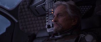 Movie still from “Ant-Man and the Wasp” (2018), directed by Peyton Reed – An older man with a gray beard looking into the distance; Close Up shot, Low angle